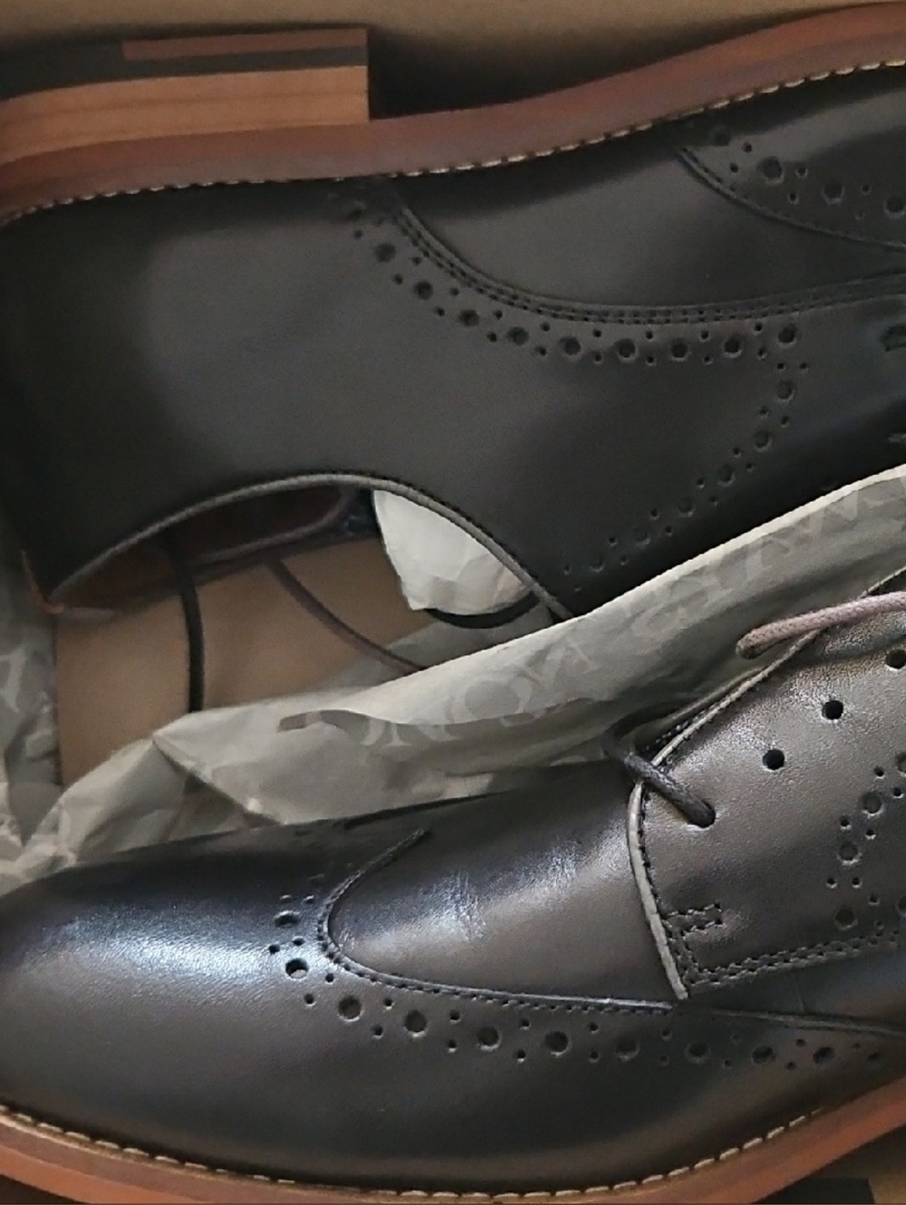 Johnston & Murphy Black Leather Wingtip Oxfords with Brown Sole